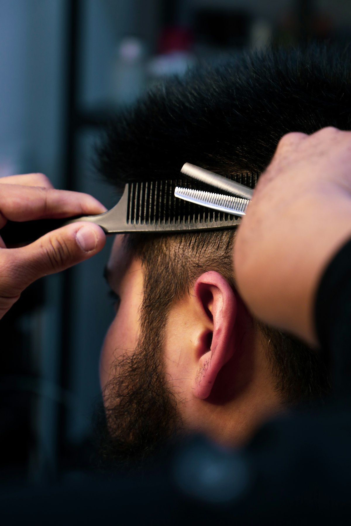 Barber using clippers for a fresh cut