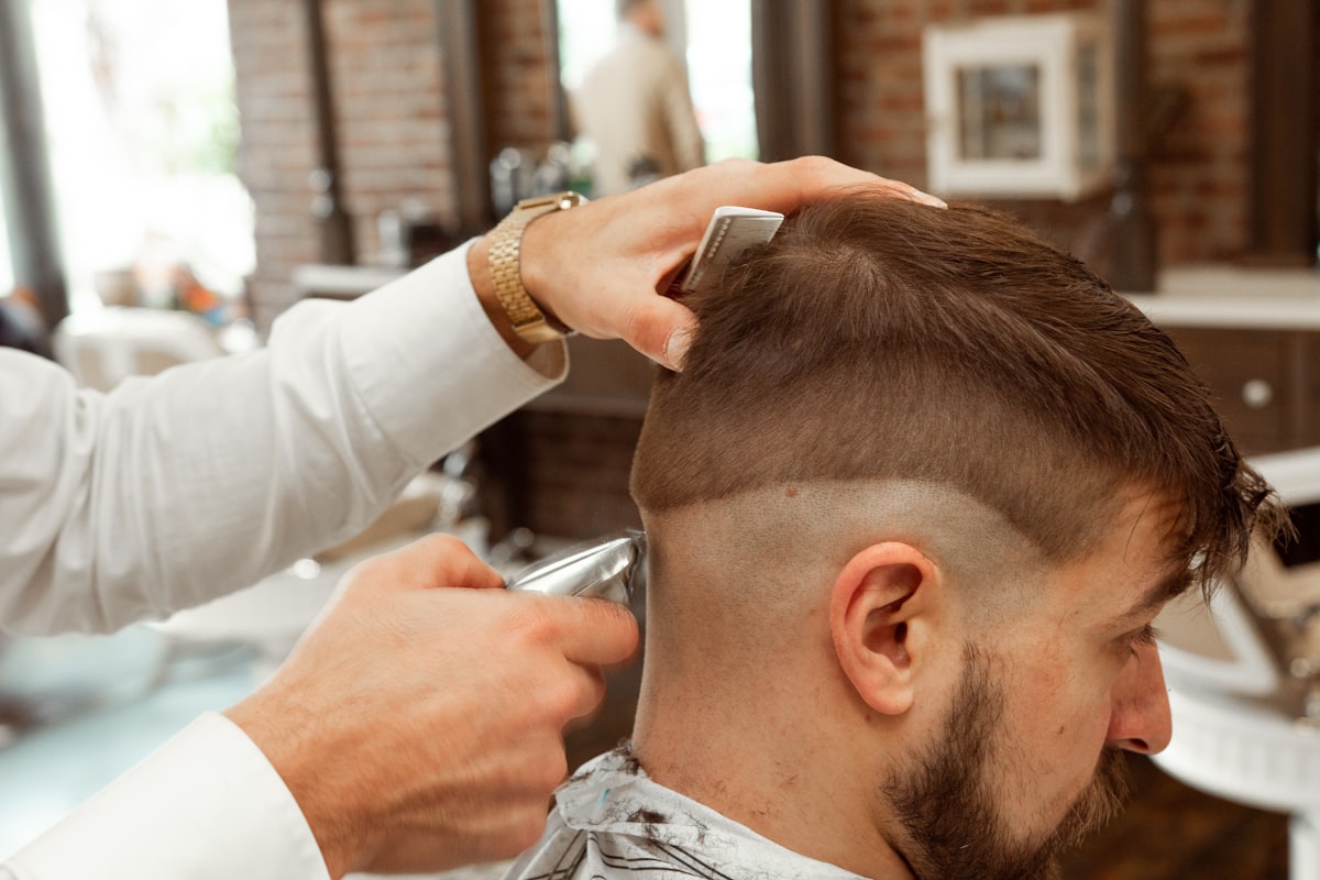 Barber cutting a client's hair