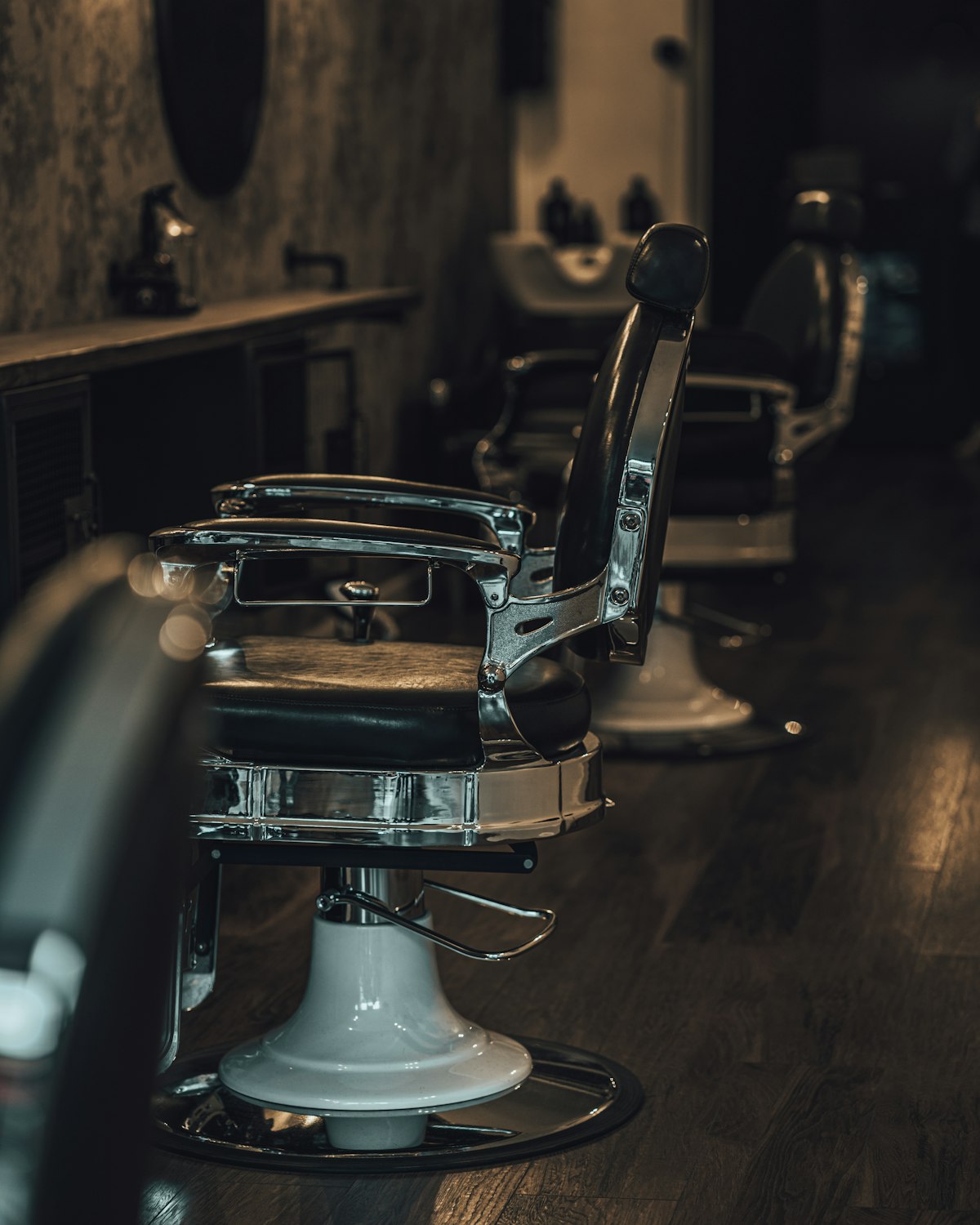Chrome and leather barber chairs in the shop